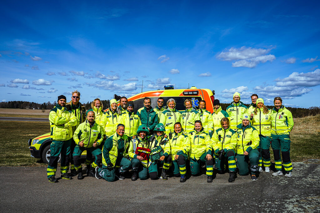 Full ambulance fleet posing for a group photo in this picture