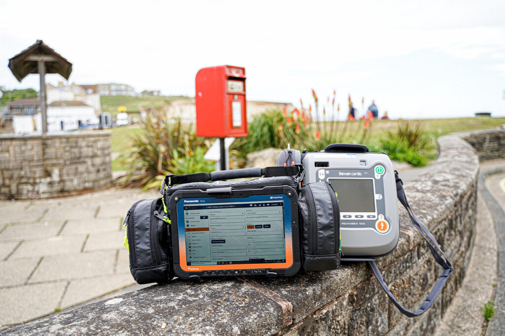 MobiMed ePR (electronic patient record) together with MobiMed Life defibrillator standing on the ground in Jersey