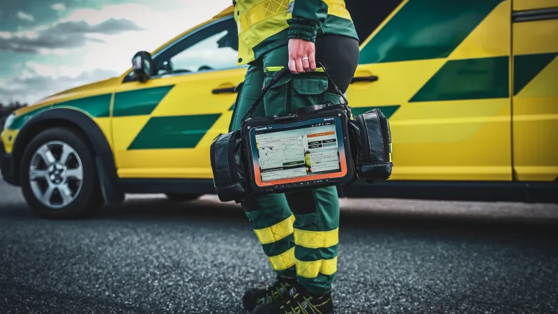 Ambulance worker carrying mobimed