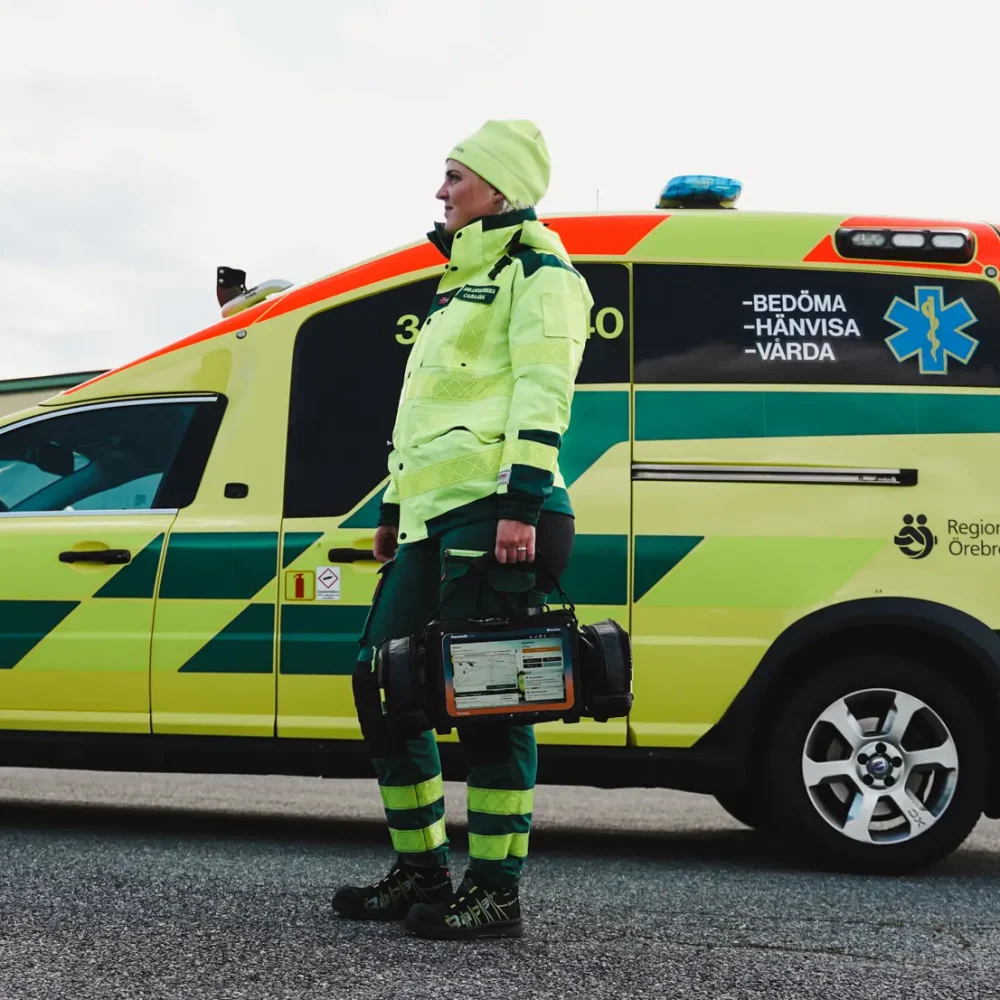 Ambulance nurse holding MobiMed